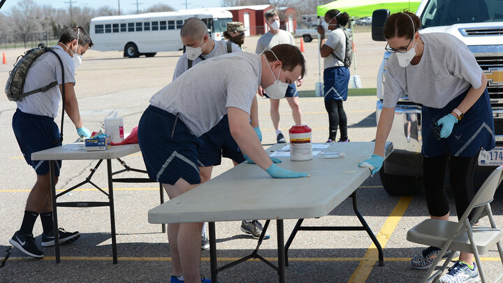 Nebraska National Guard members with the 155th Medical Group prepare a worksite for COVID-19 testing in Grand Island on April 7. The medical group, which includes Gabe Chase, is part of the Chemical, Biological, Radiological, Nuclear and Explosive Enhanced Response Force Package team. The team is an joint-force unit between the Army and Air National Guard and specializes in search and extraction, decontamination, medical, facilities search and rescue, and joint incident site communications command and…