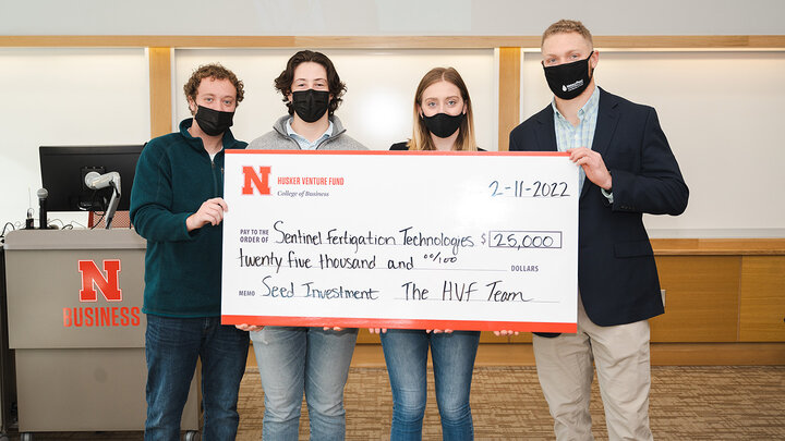 Members of the Husker Venture Fund awarded the first investment of $25,000 to Jackson Stansell, a biological systems engineering doctoral student at Nebraska. The HVF is a student-led venture capital fund that invests in Nebraska-owned early-stage startups. Pictured from left are students and managing directors of the fund Keith Nordling, Adam Folsom and Emily Kist, alongside Stansell.