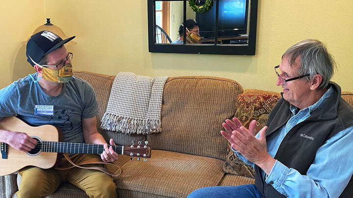 A Peninsula Homecare Cooperative caregiver interacts with a client in Port Townsend, Washington. A weekly online academy, May 4 through June 8, will walk rural Nebraska leaders through creating homecare co-ops in their communities.