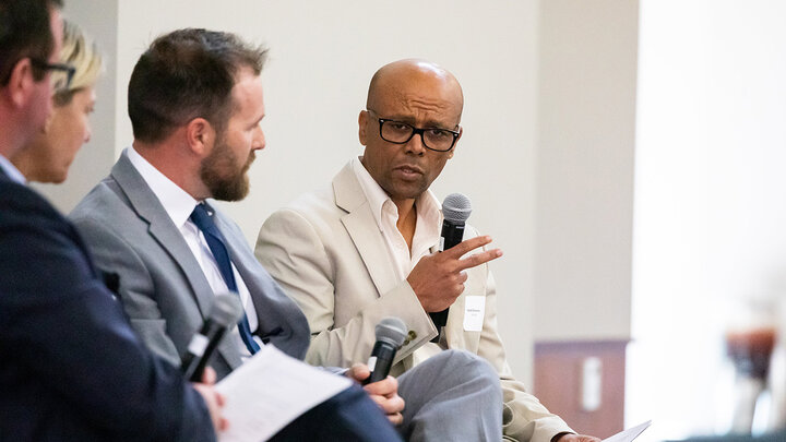 Yacob Zereyesus, senior economist with the U.S. Department of Agriculture’s Economic Research Service (right) speaks at the Yeutter Institute symposium at Nebraska Innovation Campus as a panel analyzed trade effects from the conflict in Ukraine. The other panelists (from left) were Jason Grant, professor and director of the Center for Agricultural Trade at Virginia Tech University; Katrin Kuhlmann, Georgetown University law professor and faculty co-director for the university’s Center on Inclusive Trade…