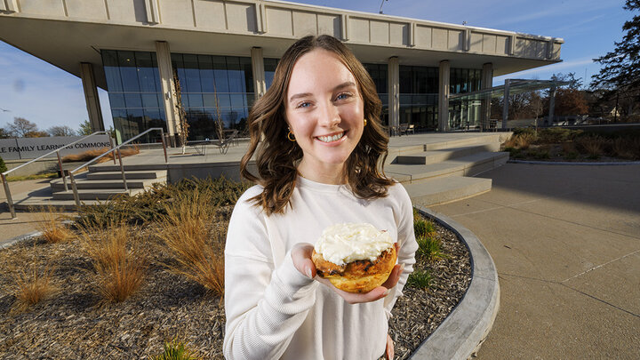 Alexa Carter holds her chili roll creation.