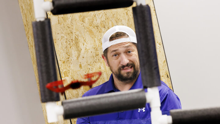 Concentration shows on Nick Restau’s face as he tries to pilot a small UAV through an obstacle course at Nebraska Innovation Studio. Restau, from Milford Public Schools, is one of several teachers training to get their drone license in a class taught by Travis Ray from NIS.