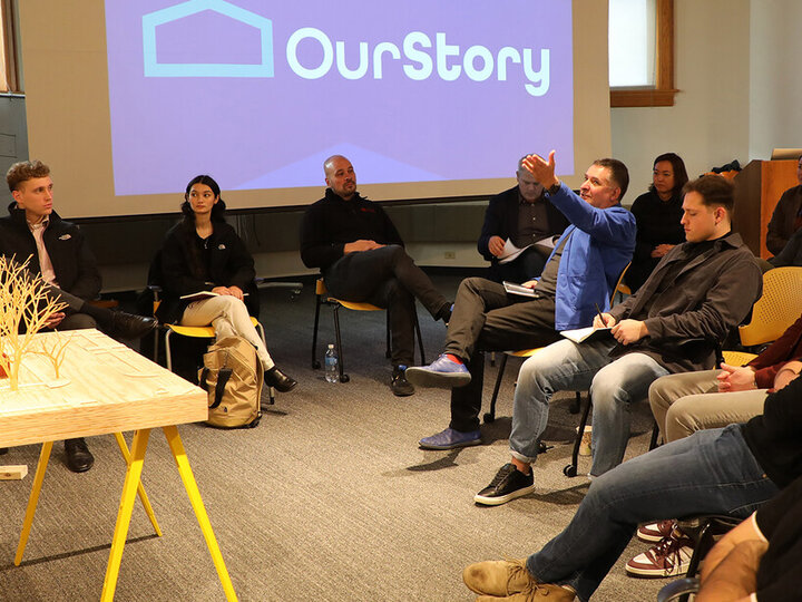 Graduates students in the FACT studio listen to feedback during their final project reviews.